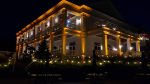 The Northland Country Club building lit in amber with garden bistro by Duluth Event Lighting